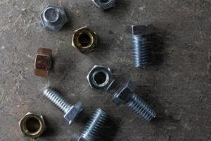 a bunch of nuts and bolts lying on the ground